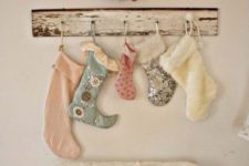 11 a cute vintage stocking display with printed vintage stockings and a shabby chic holder looks cute and stylish