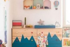 12 a double Tarva dresser with a mountain-inspired pattern and colorful knobs for an adventure-themed kid’s room