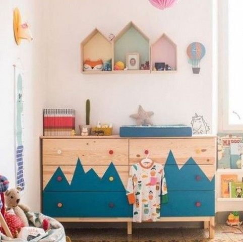 a double Tarva dresser with a mountain-inspired pattern and colorful knobs for an adventure-themed kid's room