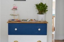14 a striped blue and white Tarva dresser with mismatching knobs is great for a beach or coastal space
