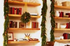 17 evergreen garlands with pinecones and red ribbons to cover the built-in niches and accent them this way