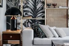 18 dramatic moody wallpaper takes over the space and chevron pillows on the sofa make the space cooler