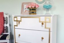 19 a vintage-inspired Tarva dresser with gold inlays and gold and crystal pulls for a touch of art deco