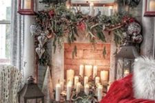 21 enchanting vintage Christmas decor with evergreens, candles, a red blanket, oversized candle lanterns and a vintage sign