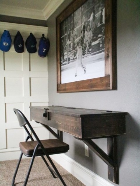 a vintage wooden floating desk with storage space inside and a matching leather chair for a vintage workspace