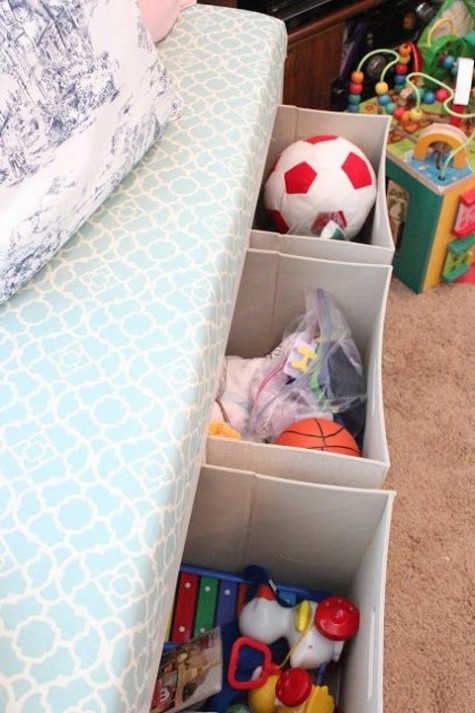 place stome Drona boxes under the kids' bed to add comfy storage and delcutter the room