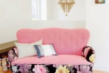 a cute pink loveseat spruced up with dark floral armrests and a pink seat and back is perfect for a feminine space