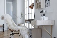 24 a whitewashed floating desk with some drawers and a matching house-shaped shelf for a Scandinavian workspace