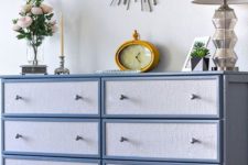 25 an IKEA Tarva hack painted blue and with blue contact paper and little geometric knobs for a chic look