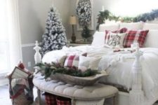 a chic farmhouse Christmas bedroom with snowy evergreens, pinecones, lots of plaid and knit