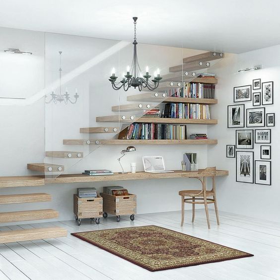 a contemporary home office with a floating desk and shelves that form the stairs and some crates on wheels for storage