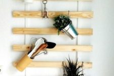 an IKEA Lattenrost hack for a kitchen with little buckets hanging – simple and creative storage