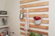 an IKEA Lattenrost kitchen hack with hooks for hanging all kinds of stuff