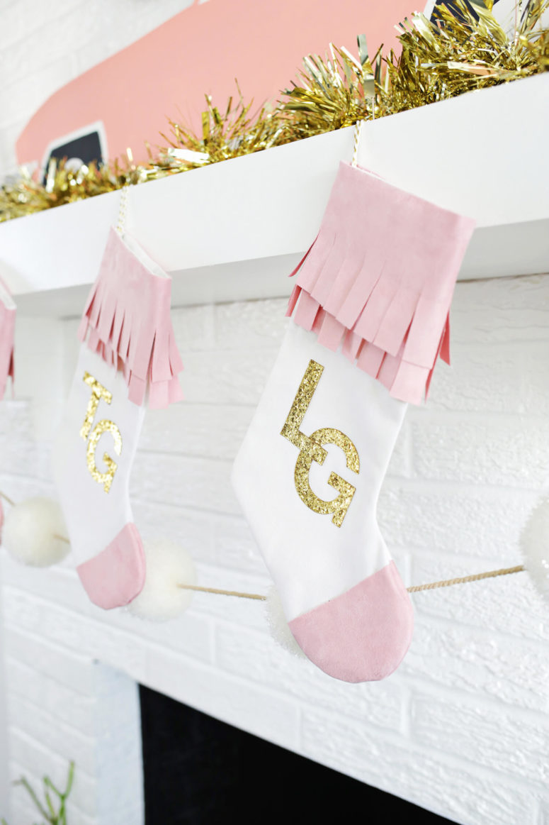 DIY glam Christmas stockings in white and pink, with gold glitter (via abeautifulmess.com)