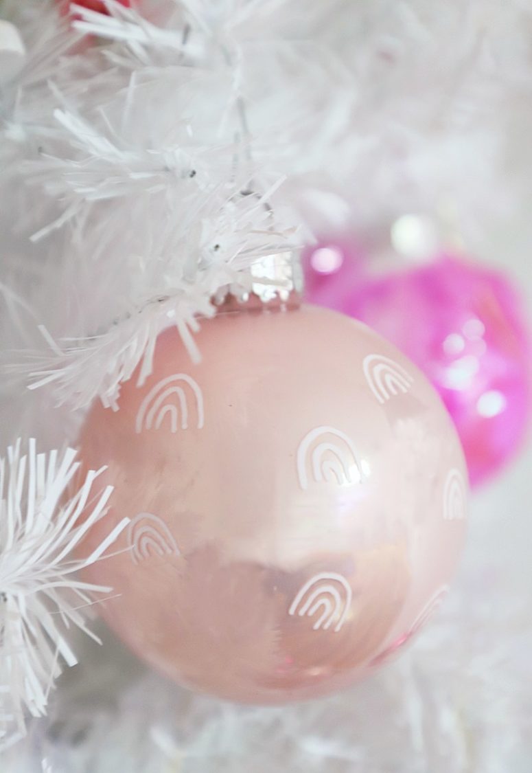DIY light pink Christmas ornaments with rainbows (via abubblylife.com)
