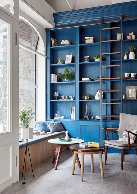 paint your built-in furniture unit in classic blue to make it stand out in the space and bring a touch of trend here