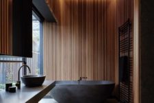 06 a moody zen bathroom done with wooden slabs and stone in dark shades, with built-in lights