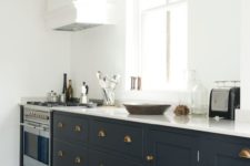 08 brass handles make the cabinets stand out and a stainless steel cooker looks not so bold