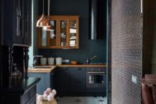 09 a moody kitchen with graphite grey cabinets, black appliances and touches of vintage style