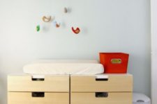 10 two IKEA Stuva cabinets with drawers turned into a changing table for a nursery – what a practical idea