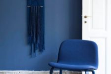 a blue wall is a great way to spruce up neutral space