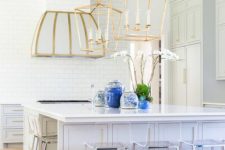 11 large brass lamps and a hood with a touch of brass are bolder than stainless steel chairs
