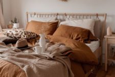 12 a cozy and welcoming earthy tone bedroom done in greys, beige, tan and rust plus some neutrals