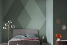 18 a green statement wall with a cool geometric design that makes the space look catchy and bold