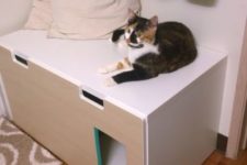 21 a Stuva storage bench with a cat litter box inside – make a cut and place some pillows up for your cat to lie there