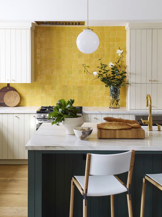 a mustard tile kitchen backsplash stands out in a neutral kitchen and makes it really wow