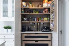 28 a small yet functional kitchen larger with drawers, shelves and wine storage plus lights