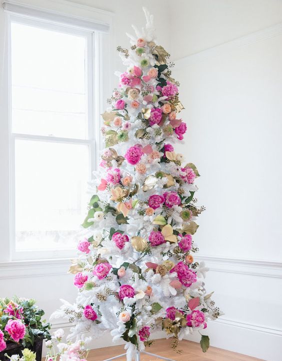 a beautiful and romantic Valentine tree decorated wuth fresh flowers in pink, blush and yellow plus foliage