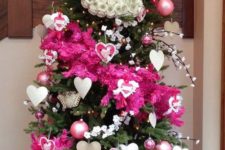 a bright Valentine tree with pink stripes, lights, cherry blossom, usual and heart ornaments and paper decor