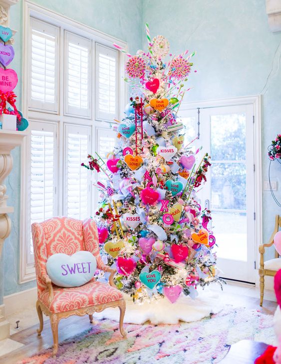 a bright and fun Valentine's Day tree decorated with hearts, donuts, lights and colorful ornaments of all kinds