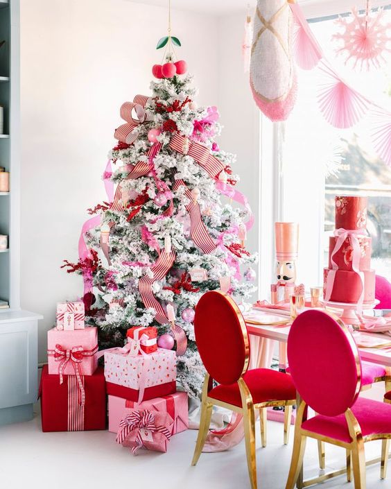 a chic Valentine tree with striped ribbons, pink ornaments and red twigs is a very romantic idea