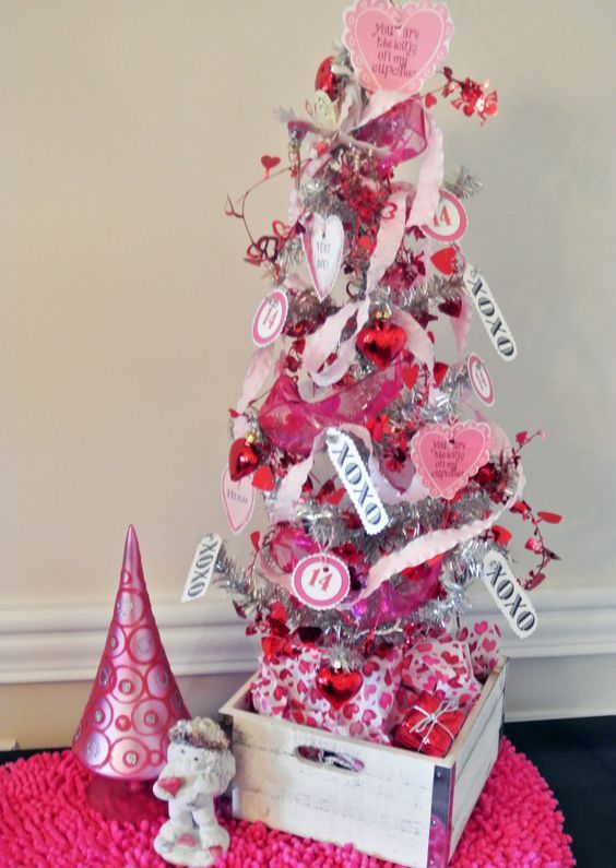 a cute tabletop Valentine tree in silver, with tags, pink ribbons, mini paper hearts and toppers