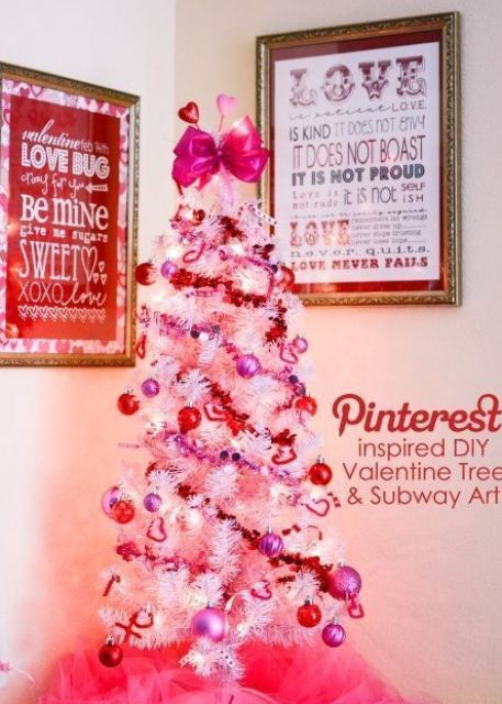 a mini white tree with lights and glitter pink and red ornaments plus a pink bow on top is a cute idea