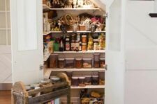a staircase pantry built in, with many shelves and additional lights