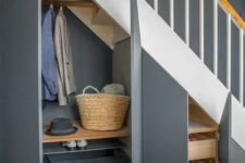 a staircase with open cabinets and drawers is a cool built-in mudroom that can be rocked in your space to save it