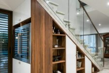 built-in niche shelves, a wine cooler right in the staircase are a cool idea