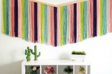 DIY colorful boho wall hanging that takes a whole wall