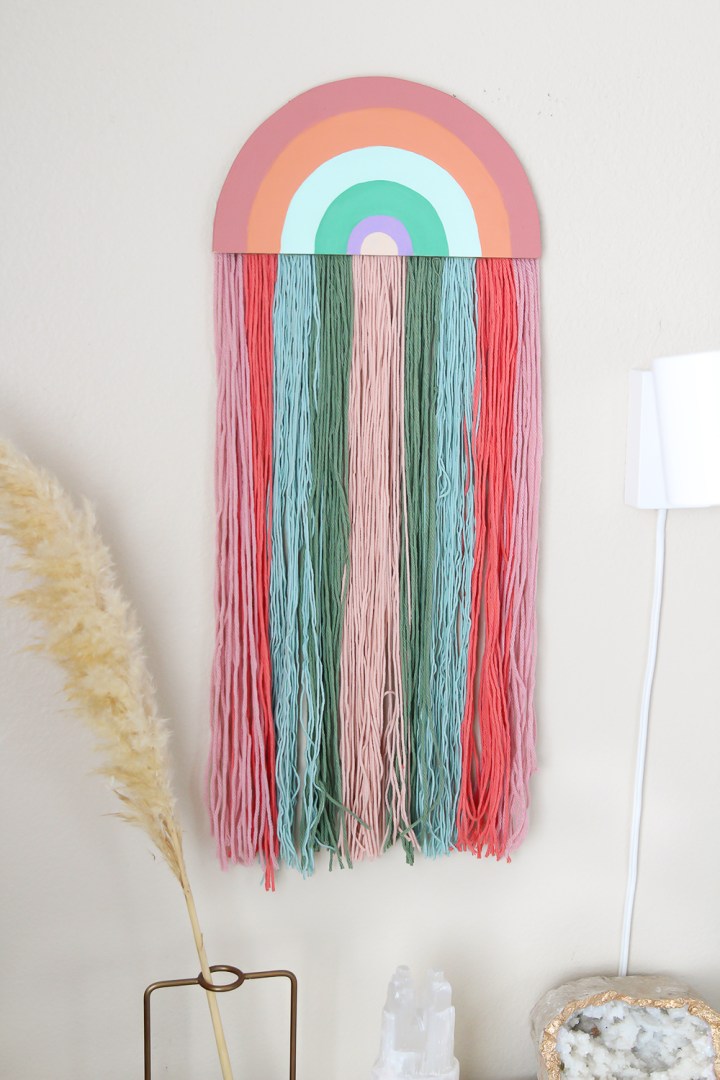 DIY rainbow wall hanging using a piece of plywood
