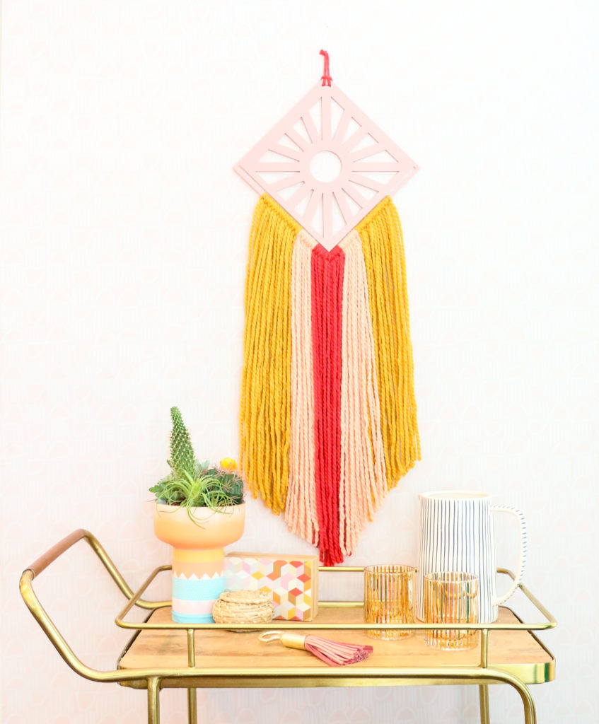 DIY colorful boho wall hangings with various plywood detailing