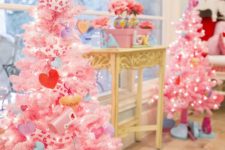 mini Valentine trees in pink with heart ornaments and conversation hearts, lights and heart print ribbons