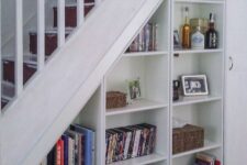 open storage compartments and a storage unit with a door are a good idea for a staircase, to save some space and store