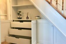 storage cabinets, open shelves and drawers are a great solution for a staircase, they will deluctter your space and make it organized
