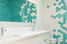02 cream and turquoise hex tiles on the wall create a bold mosaics that makes the space unique and eye-catching