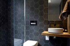 03 large scale matte black hexagon tiles with white grout make the walls bold and outstanding
