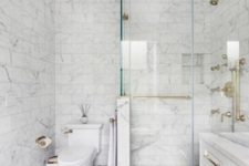 04 white marble tiles on the walls and floor, smaller ones and larger ones on the floor for a timeless bathroom look