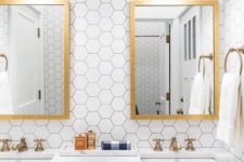 08 white hex tiles with black grout, gold mirrors, faucets and scaonces make the space elegant and stylish
